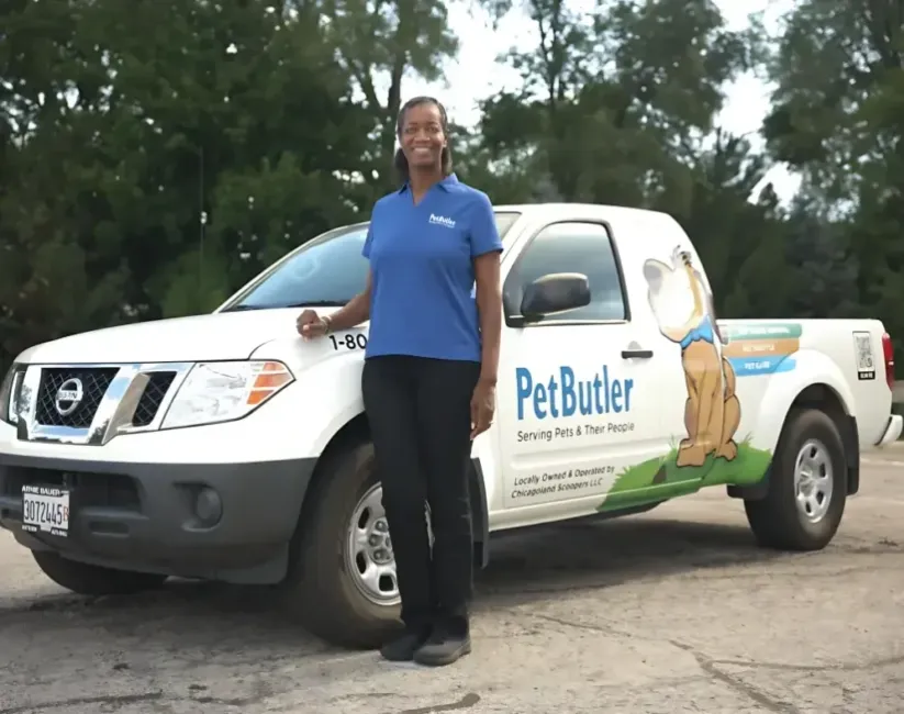 Mary Lester, owner of Pet Butler of Tallahassee, FL, standing next to a Pet Butler truck.