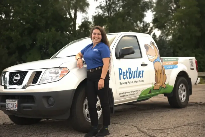 Courtney Elliott, owner of Pet Butler of Smyrna, GA, standing next to a Pet Butler truck.