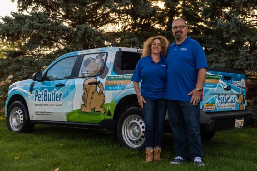 Michael Kidd, owner of Pet Butler of Cary, NC, standing next to a Pet Butler truck.