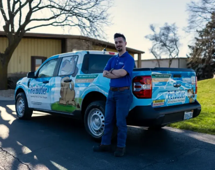 Andrew Alexander, owner of Pet Butler of Fredericksburg, VA, standing next to a Pet Butler truck.