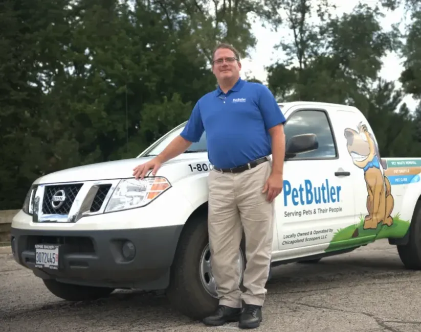 John Andrade, owner of Pet Butler of Warwick, RI, standing next to a Pet Butler truck.