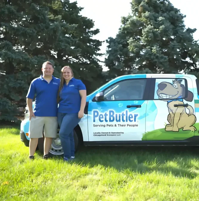 Nick and Rachel Graziano, owners of Pet Butler of Ann Arbor, MI, standing next to a Pet Butler truck.