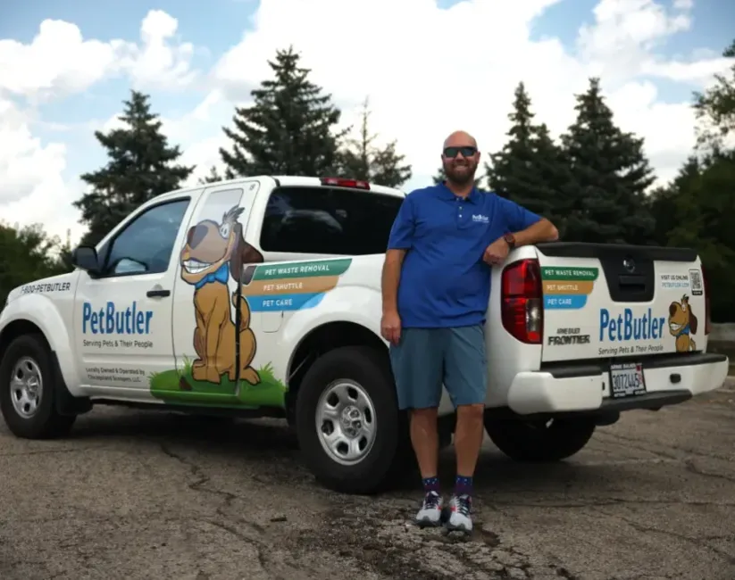 Eric Hoffpauir, owner of Pet Butler of San Antonio, TX, standing next to a Pet Butler truck.