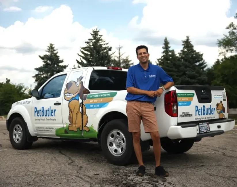 Cesar Jimenez, owner of Pet Butler of Scottsdale, AZ, standing next to a Pet Butler truck.