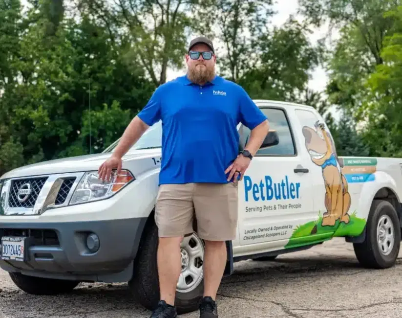Jared Stone, from Pet Butler of Dallas, TX, standing next to a Pet Butler truck.