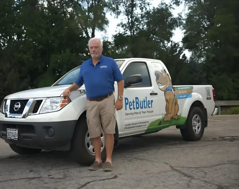 Bill Ewing, owner of Pet Butler of Boca Raton, FL, standing next to a Pet Butler truck.