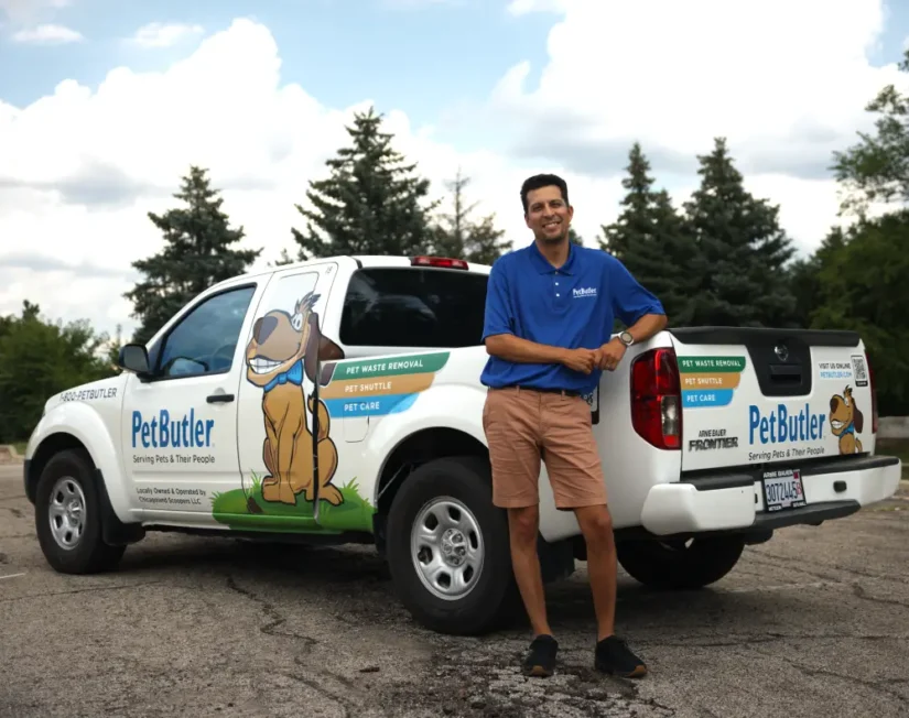 Cesar Jimenez, owner of Pet Butler of Phoenix, AZ, standing next to a Pet Butler truck.
