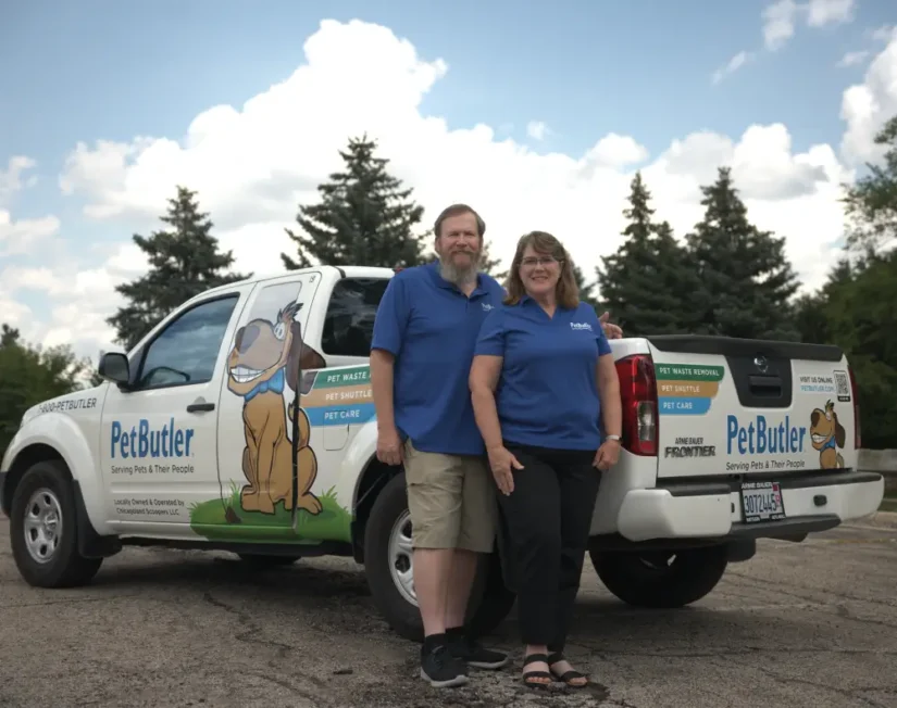 Pat and Sandy Kelly, owners of Pet Butler of Lexington, KY, standing next to a Pet Butler truck.