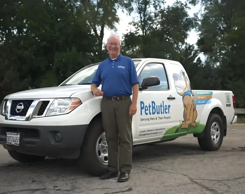 Richard Raymond, owner of Pet Butler of Mission Viejo, CA, standing next to a Pet Butler truck.