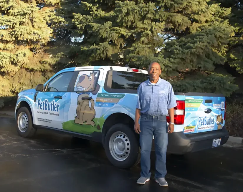 Pet Butler Franchise owner in front of Pet Butler truck