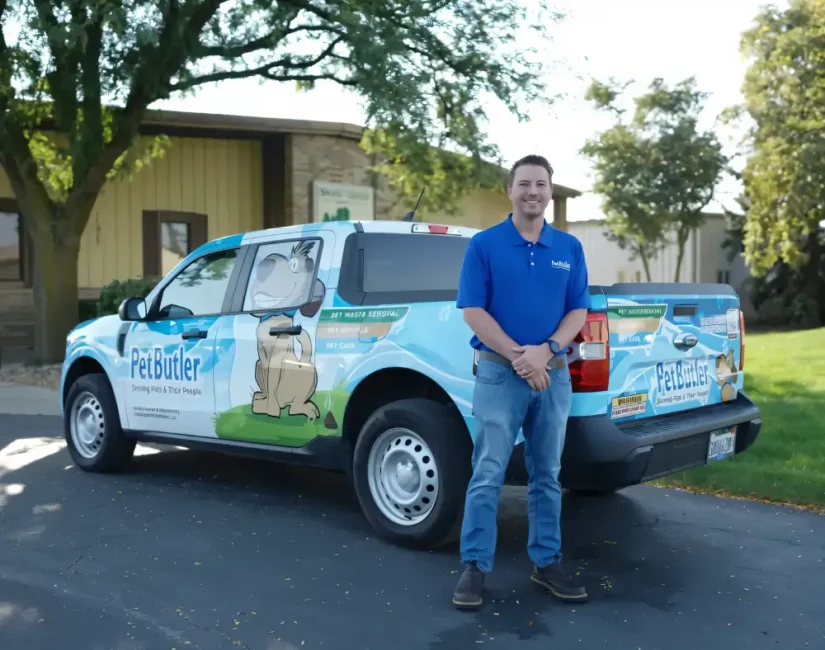 Pet Butler Franchise owner in front of Pet Butler truck