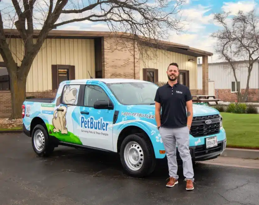 Leo Hetzendorfer, owner of Pet Butler of St. Petersburg, FL standing next to a Pet Butler truck.